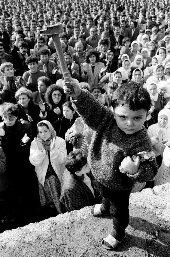 A young Turkish boy raises up a hammer during a solidarity rally for the 42,000 miners on strike in the Zonguldak coal fields, November 1990