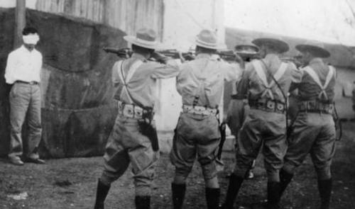 A Cuban rebel is executed by a firing squad, 1956.